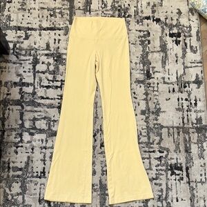 Woman’s Aritzia Yellow Flared Leggings